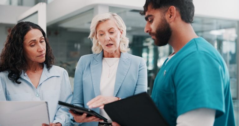 Healthcare professionals reviewing a case together